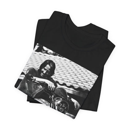 A black graphic t-shirt featuring a black and white photo of Keanu Reeves on a motorcycle.