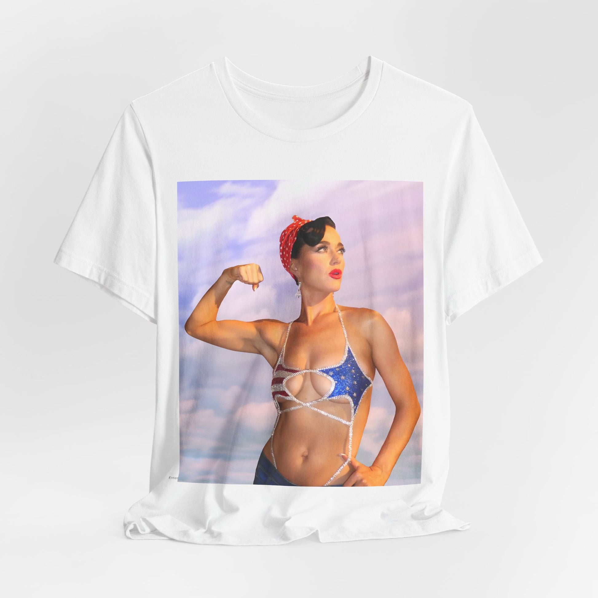 A black graphic t-shirt featuring a bold graphic of Katy Perry as a pop superstar.