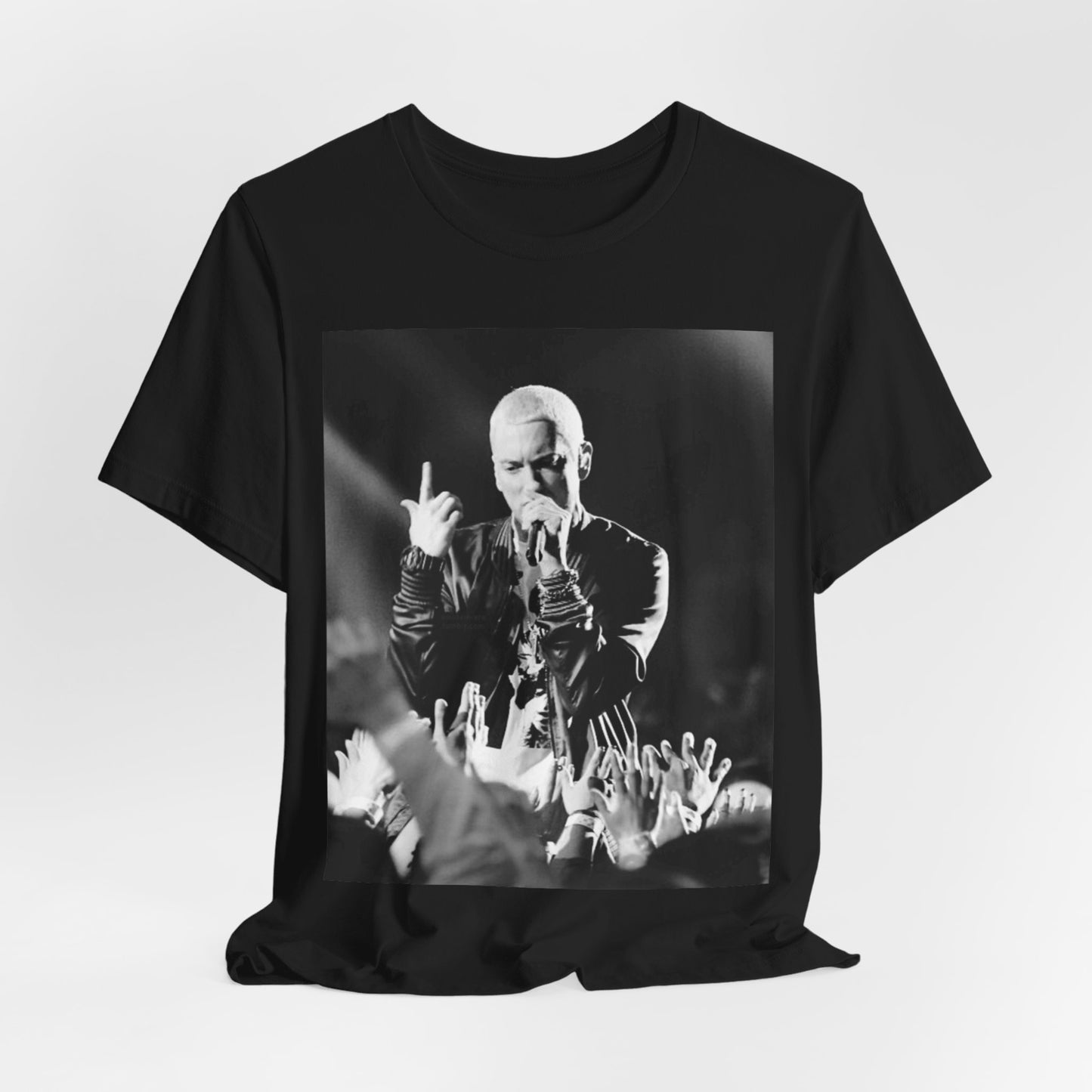 A black graphic t-shirt featuring a graphic or photo of Eminem performing live on stage.