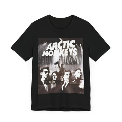 A black graphic t-shirt featuring a retro-style logo for the band Arctic Monkeys.