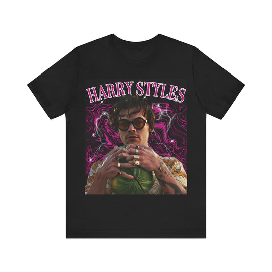 A black graphic t-shirt featuring a bootleg-style pop graphic of Harry Styles.