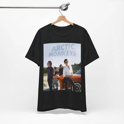 A black graphic t-shirt featuring a design related to Arctic Monkeys' 'AM' album era, possibly with the album art or band imagery.