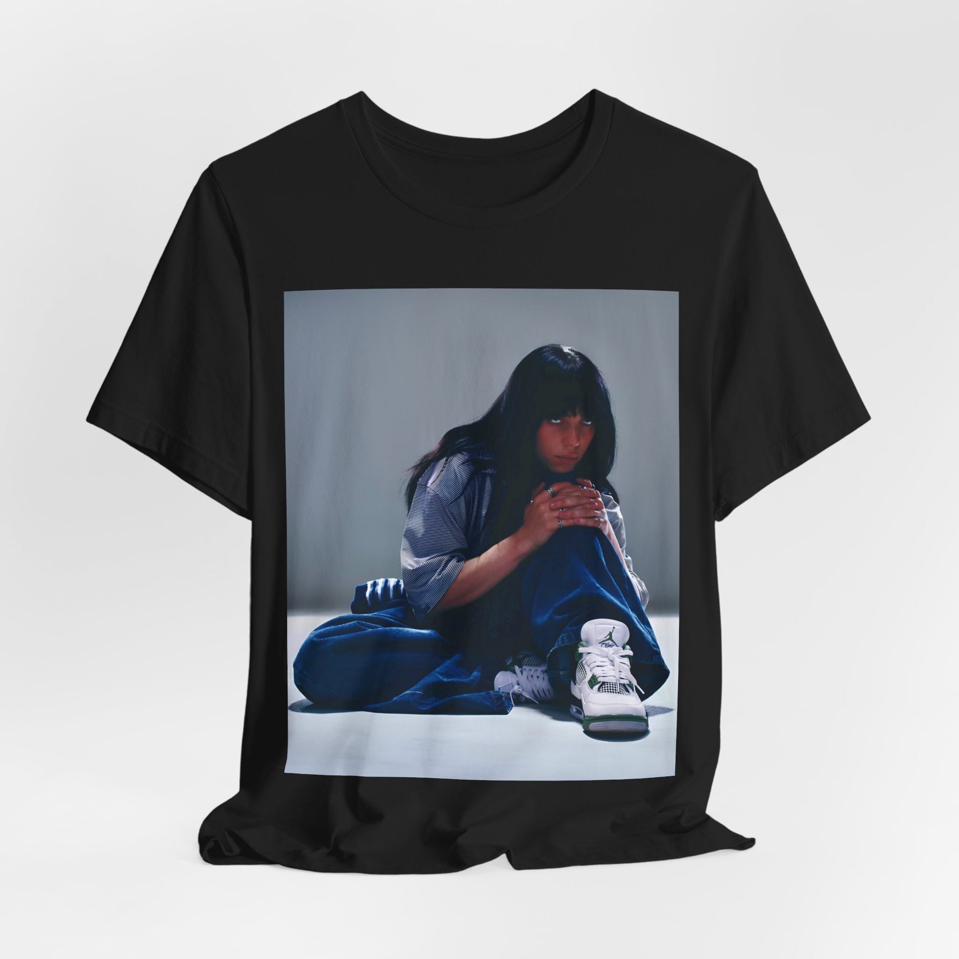 An artistic and slightly melancholic graphic t-shirt inspired by Billie Eilish's song "Lovely," featuring soft colors and a dreamy style.
