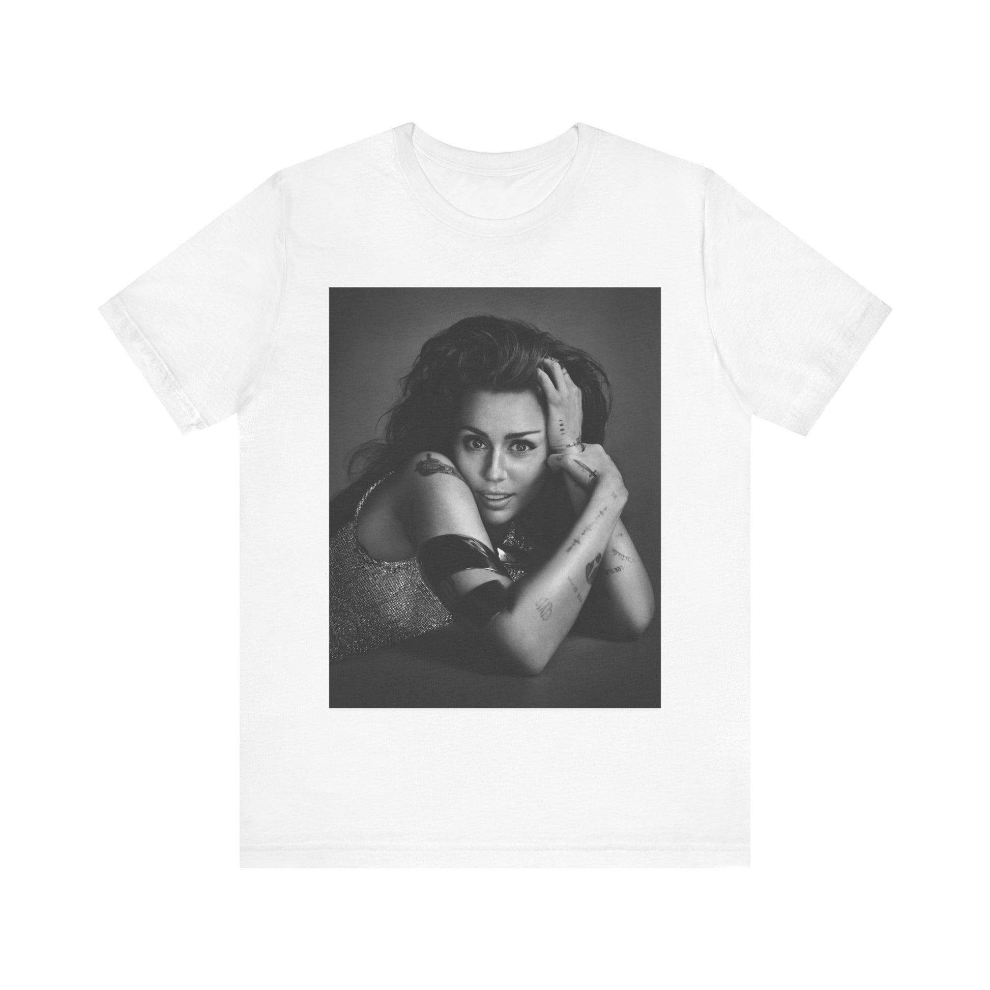 A black graphic t-shirt featuring a black and white portrait graphic of Miley Cyrus.