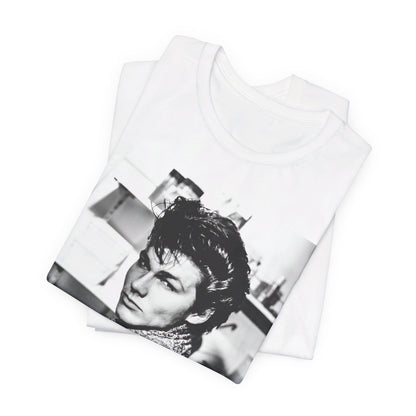A black graphic t-shirt featuring a retro 1986-style graphic for the band A-HA, possibly with band members in a stylized design.