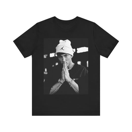 A black graphic t-shirt featuring a black and white portrait photo of Eminem.