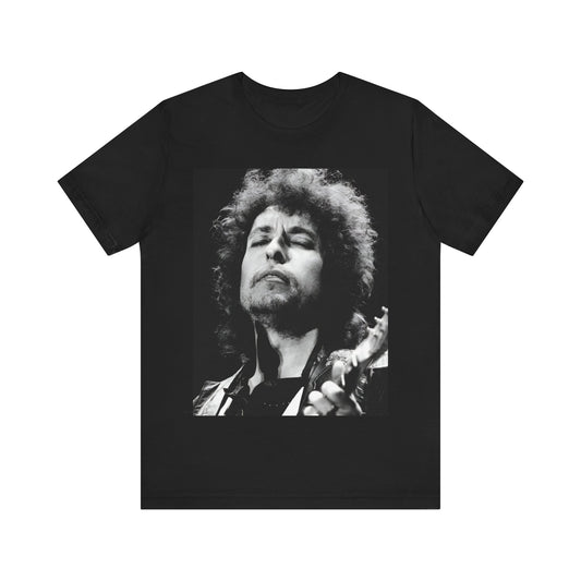 A black graphic t-shirt featuring a retro black and white graphic or photo of Bob Dylan performing live.
