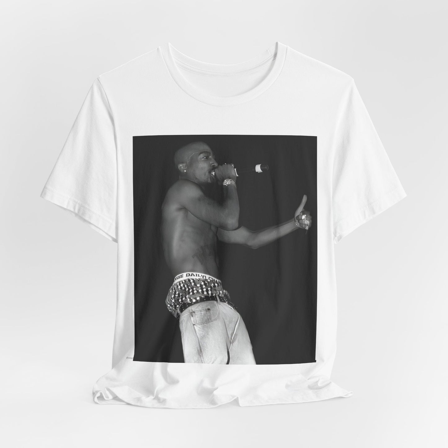 A black graphic t-shirt featuring a graphic of Tupac as a justice fighter.