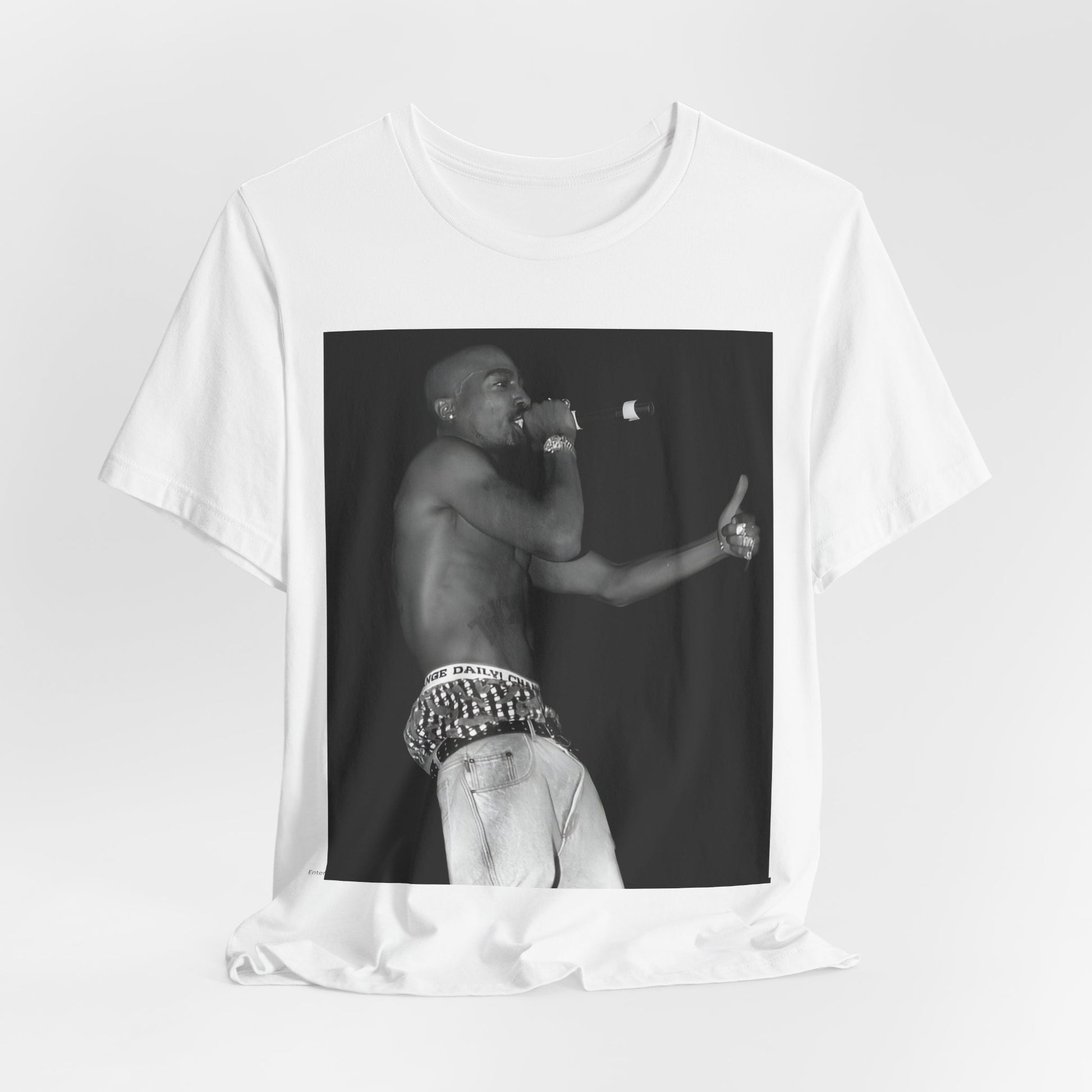 A black graphic t-shirt featuring a graphic of Tupac as a justice fighter.