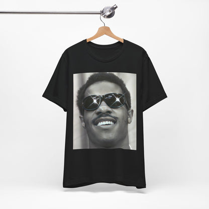 A black graphic t-shirt featuring a 70s funk aesthetic black and white graphic or photo of Stevie Wonder.