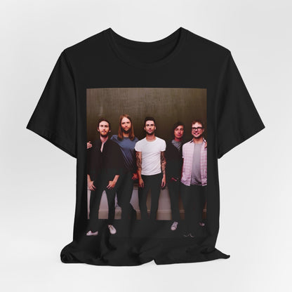 A black cotton Maroon 5 t-shirt featuring a graphic of an artistic, emotional heart design.