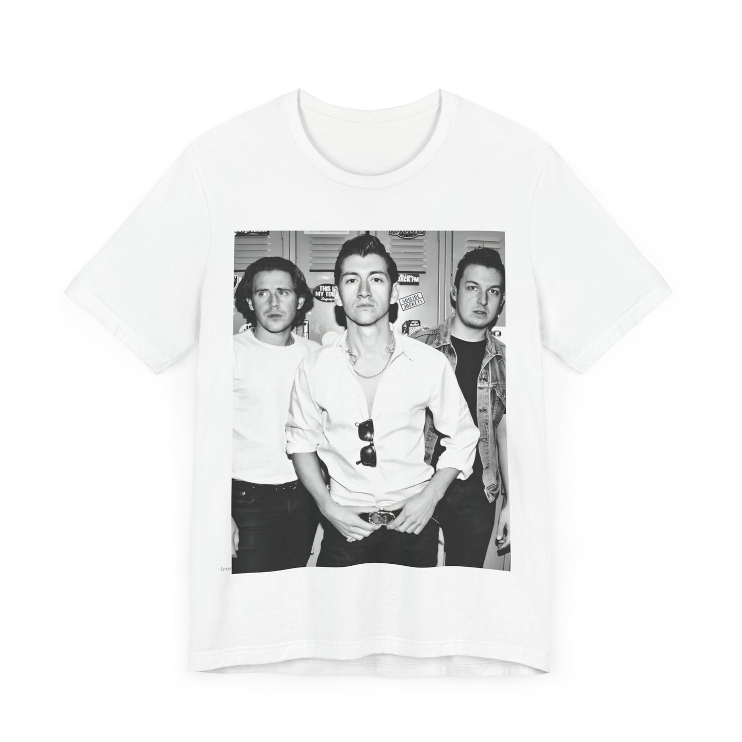 A black graphic t-shirt featuring a vintage-style design related to Arctic Monkeys' 'AM' album era, possibly with the album art or band imagery.