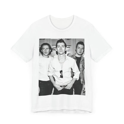 A black graphic t-shirt featuring a vintage-style design related to Arctic Monkeys' 'AM' album era, possibly with the album art or band imagery.