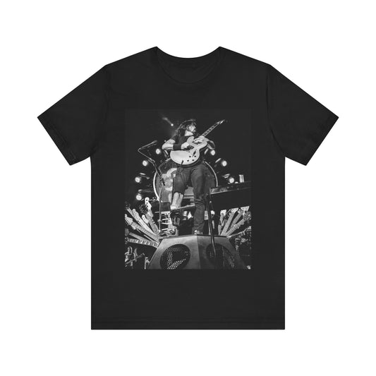 A black graphic t-shirt featuring a vintage photo of Foo Fighters performing live.