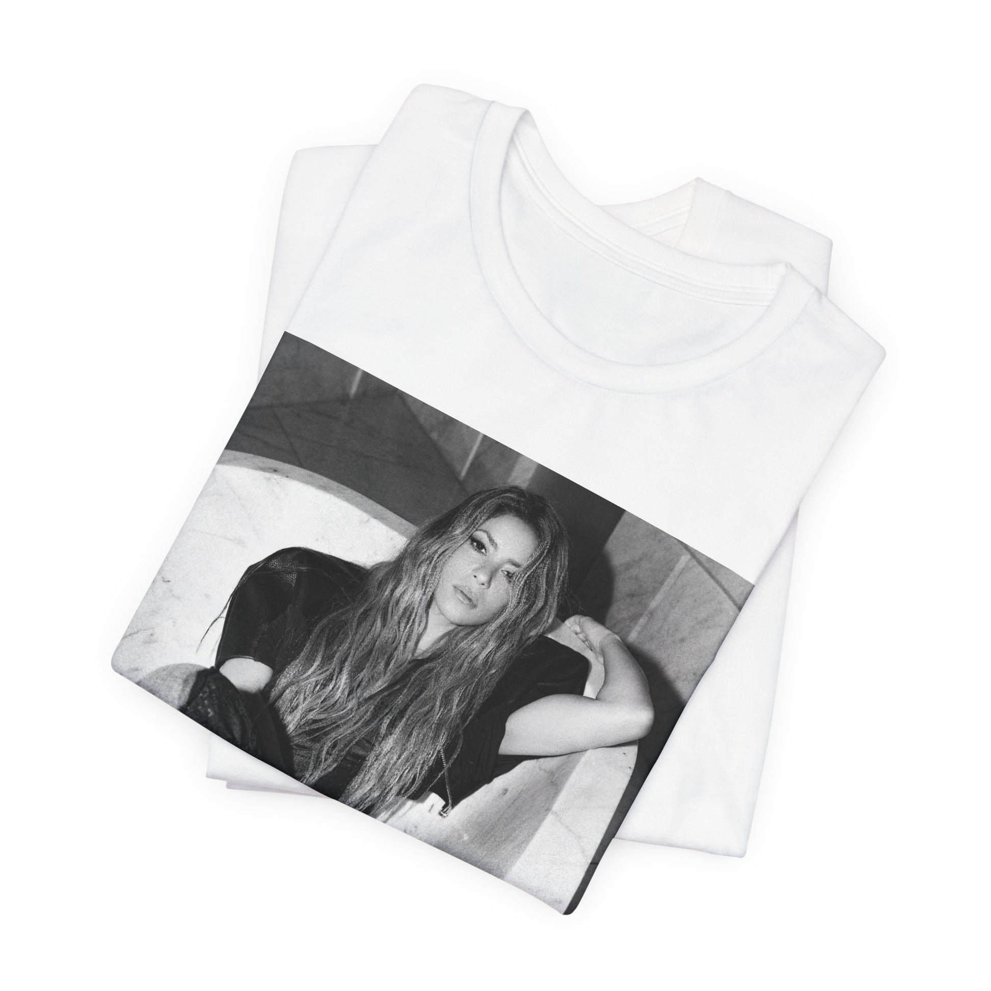 A black graphic t-shirt featuring a retro graphic related to Shakira's 'Hips Don't Lie' song or era.