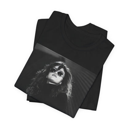 A black graphic t-shirt featuring a black and white, monochrome graphic or photo of Selena Gomez.