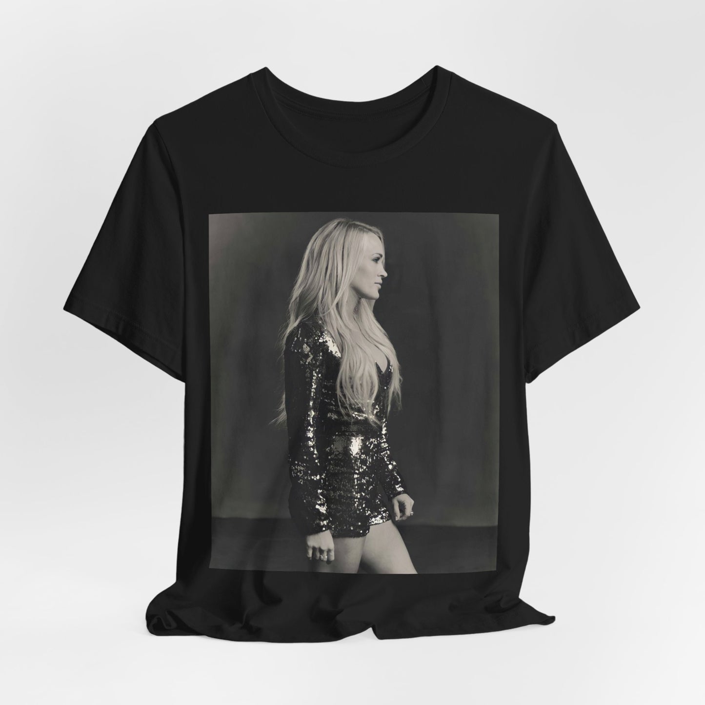 A black graphic t-shirt featuring a black and white photo of Carrie Underwood performing live on stage.