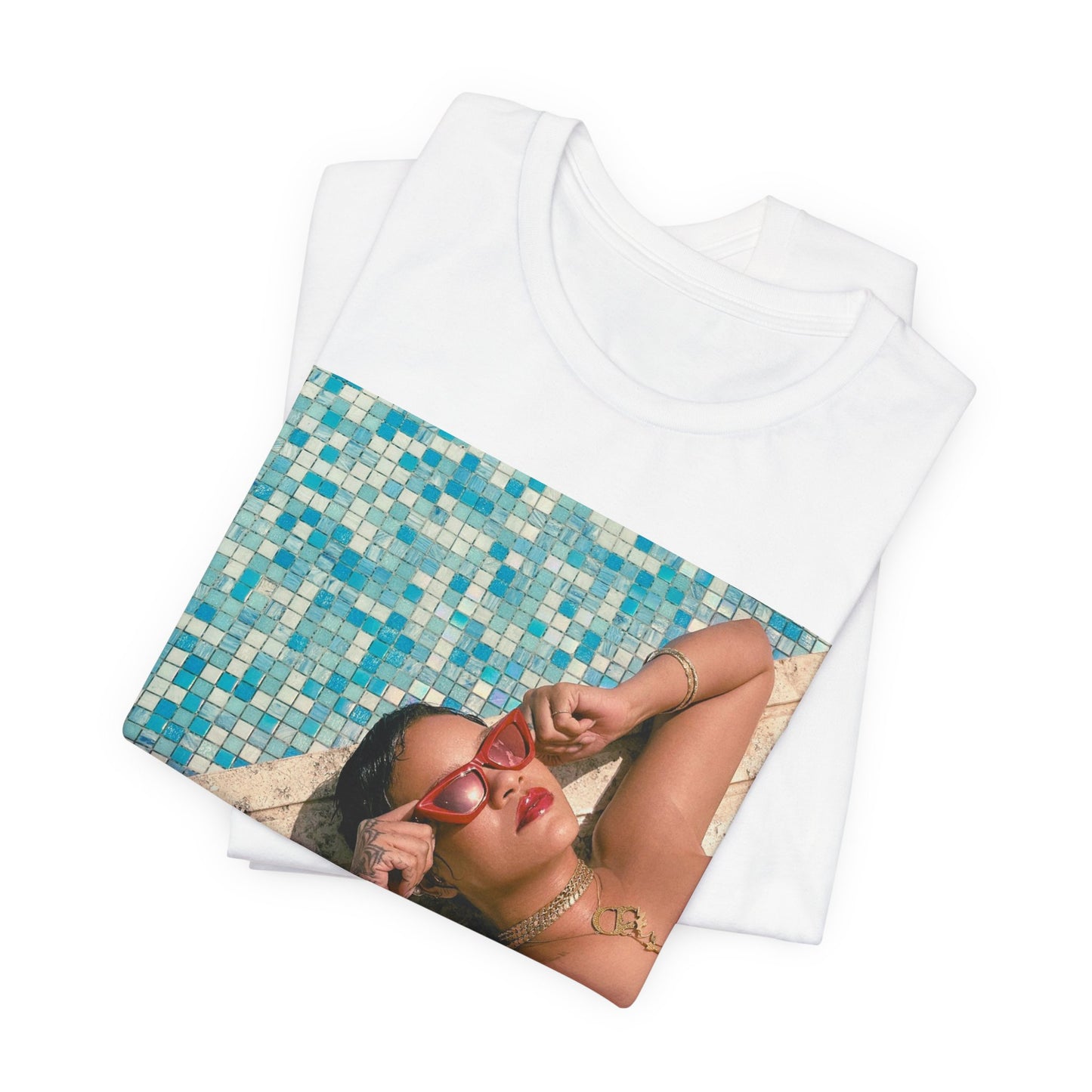 A black graphic t-shirt featuring a graphic of Rihanna in swimwear as a pop star queen.