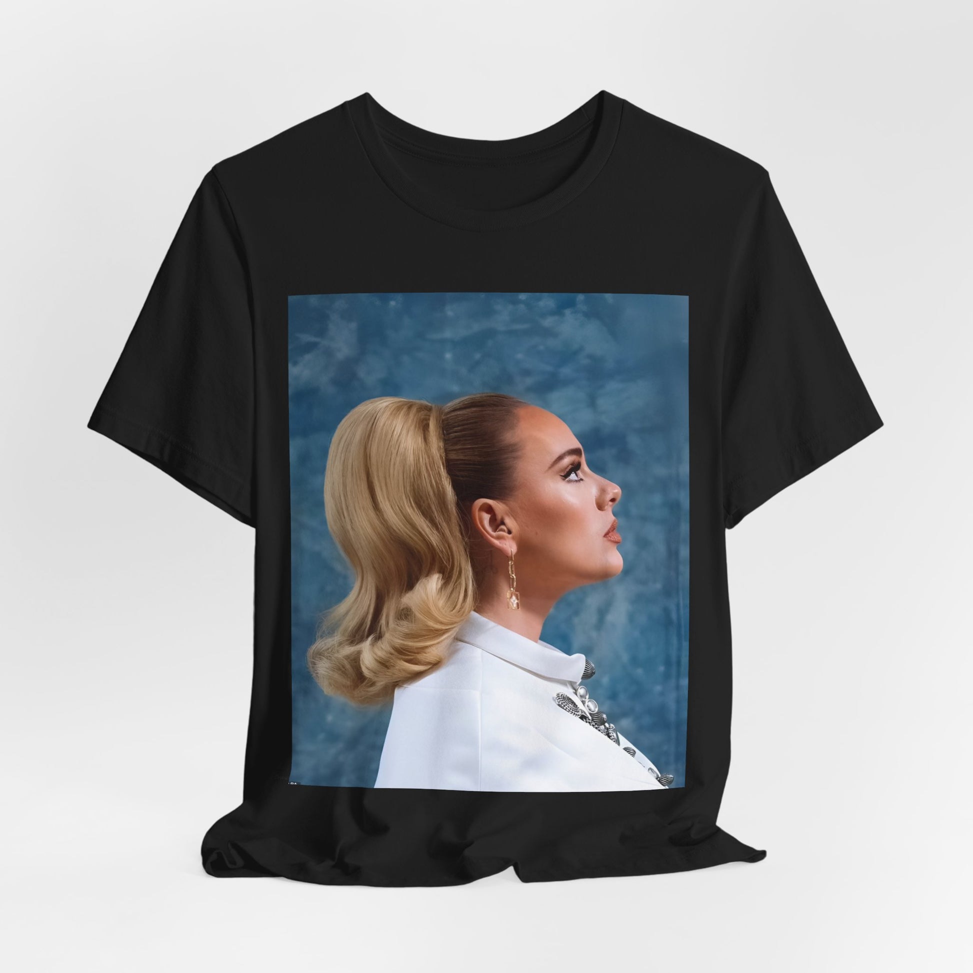 A black graphic t-shirt featuring a black and white photo of Adele in a vintage glamorous look, with classic hair and makeup.