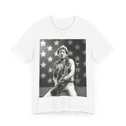 A black graphic t-shirt featuring a black and white graphic of Bruce Springsteen with an American flag background or elements.