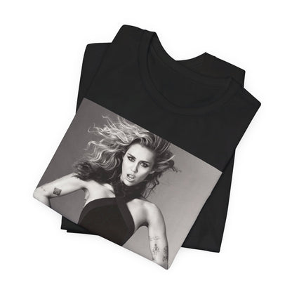 A black graphic t-shirt featuring a bold graphic of Miley Cyrus as a pop superstar.