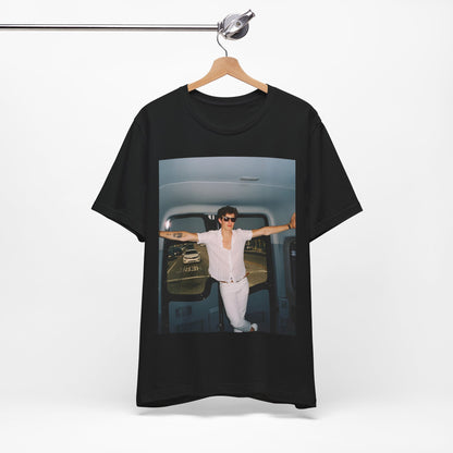 A black graphic t-shirt featuring a graphic of Shawn Mendes with a classic confident look.