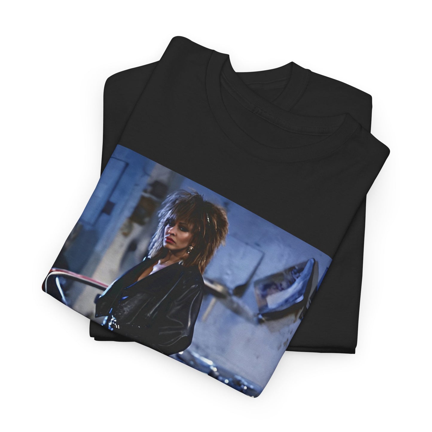A black graphic t-shirt featuring an 80s graphic of Tina Turner as a powerful rock woman.