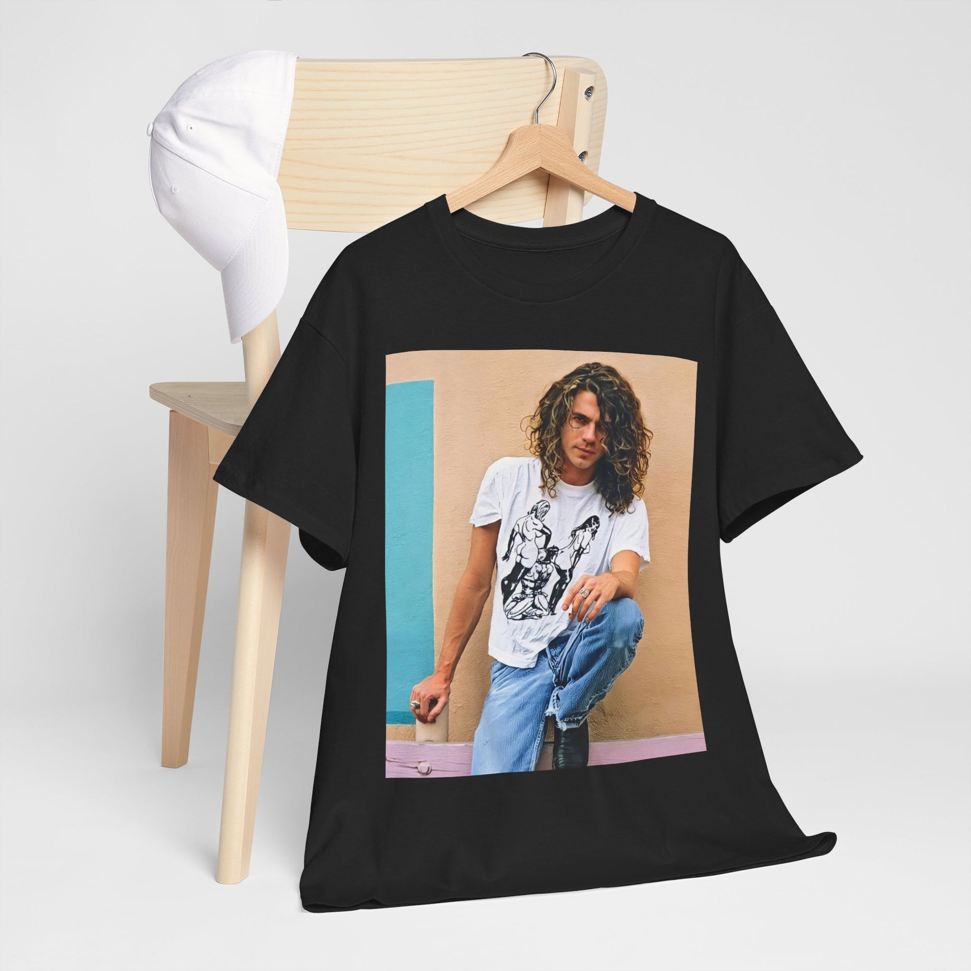 A black graphic t-shirt featuring a 90s chill retro rock graphic of INXS.