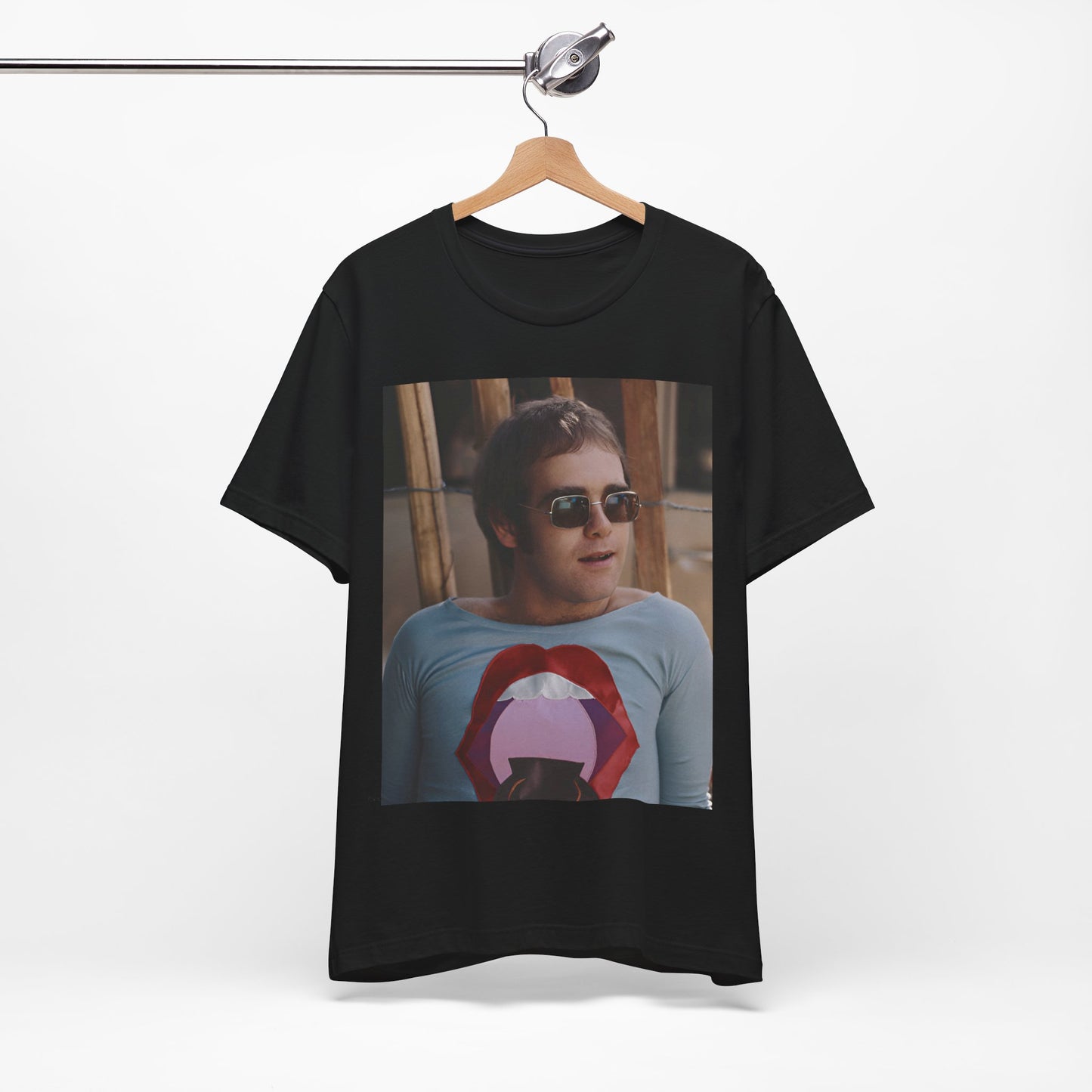 A black graphic t-shirt featuring a classic graphic related to Elton John's 'Tiny Dancer' song or era.