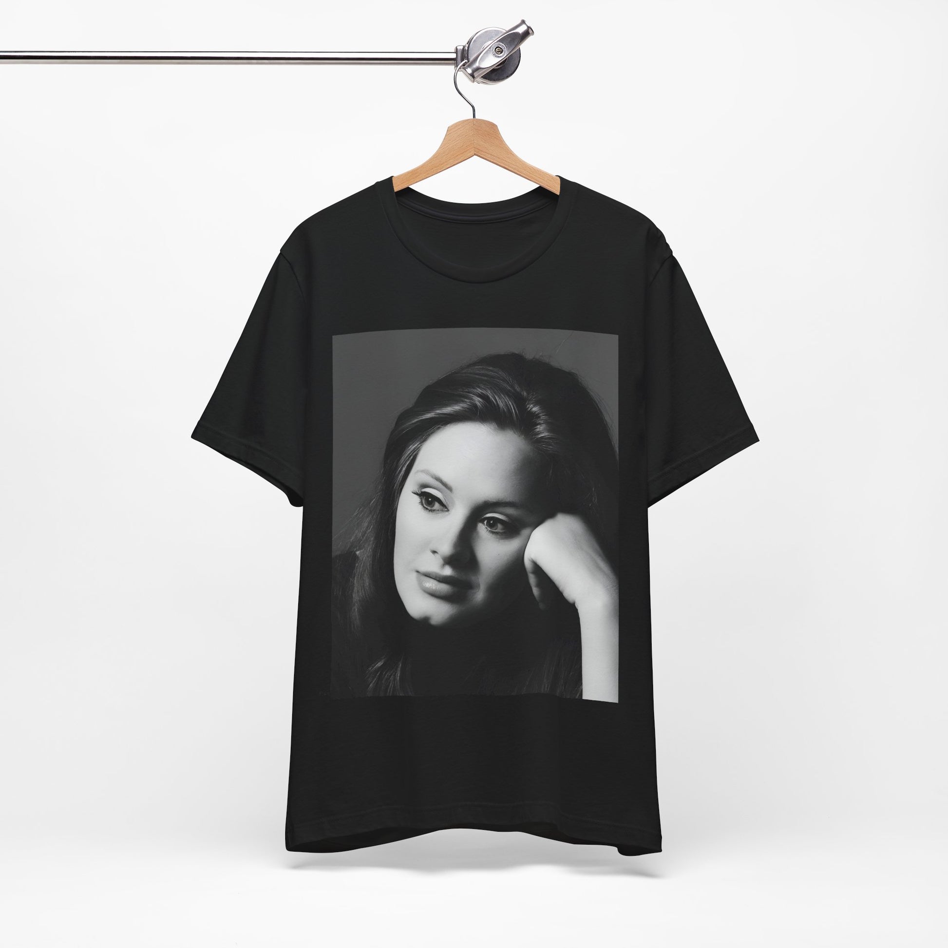 A black graphic t-shirt featuring a vintage-style black and white studio portrait of Adele, showing her with a poised and elegant expression.