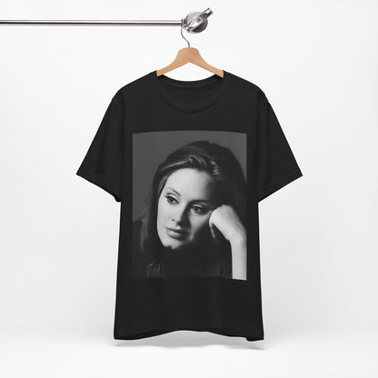 A black graphic t-shirt featuring a vintage-style black and white studio portrait of Adele, showing her with a poised and elegant expression.