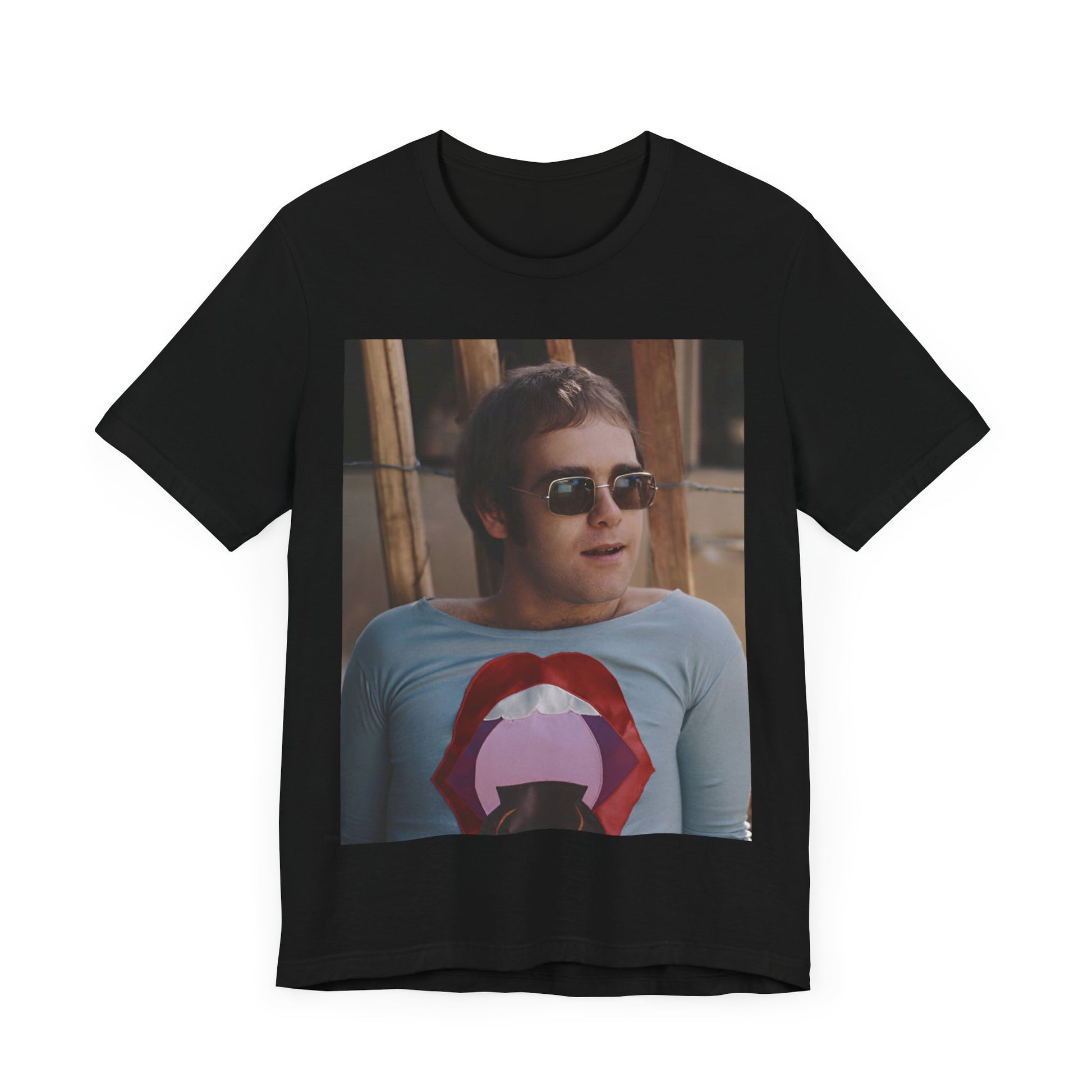 A black graphic t-shirt featuring a classic graphic related to Elton John's 'Tiny Dancer' song or era.