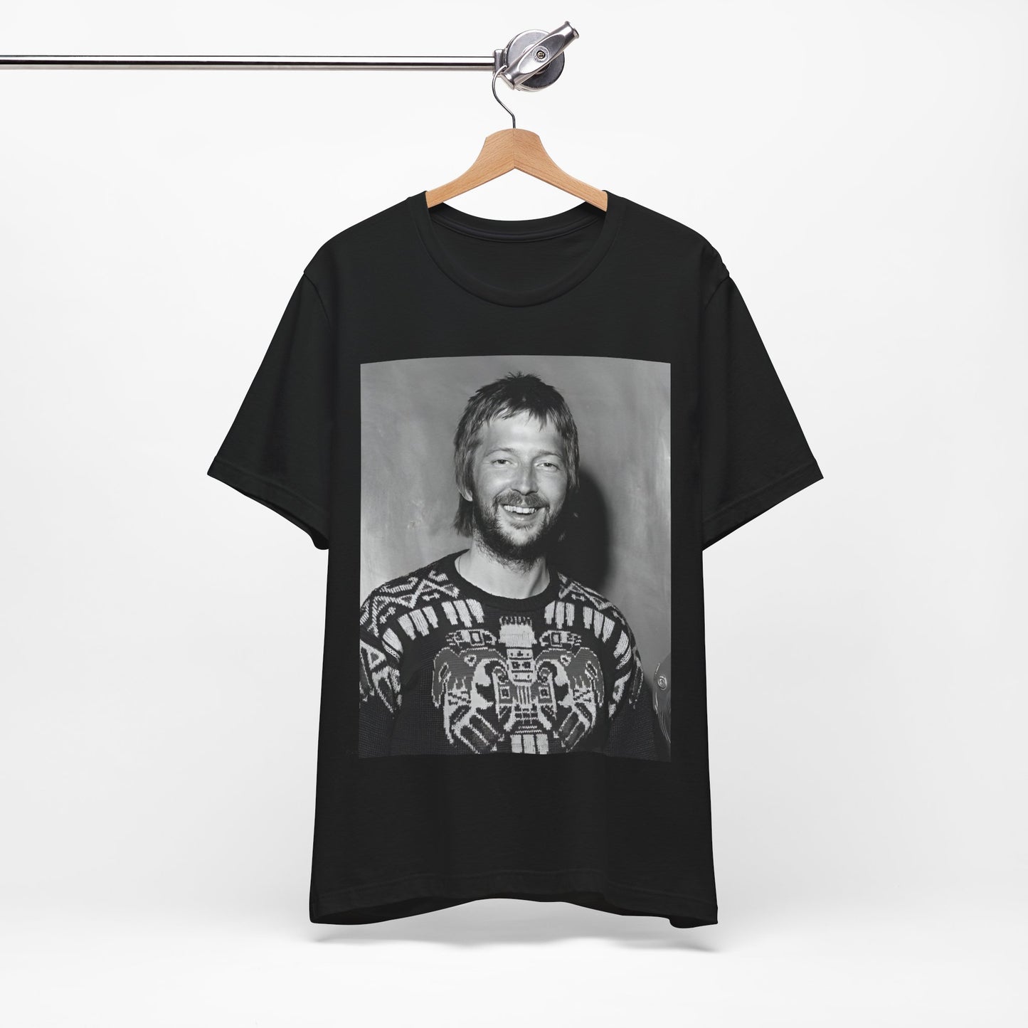 A black graphic t-shirt featuring a 70s photo portrait of Eric Clapton.