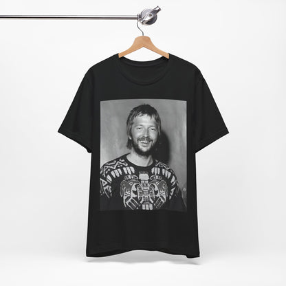 A black graphic t-shirt featuring a 70s photo portrait of Eric Clapton.