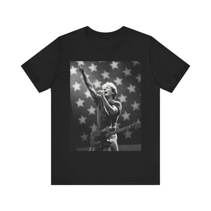 A black graphic t-shirt featuring a 70s era Americana-style graphic of Bruce Springsteen.