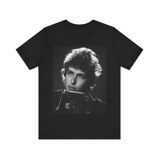 A black graphic t-shirt featuring a graphic of Bob Dylan from the 60s playing his harmonica.