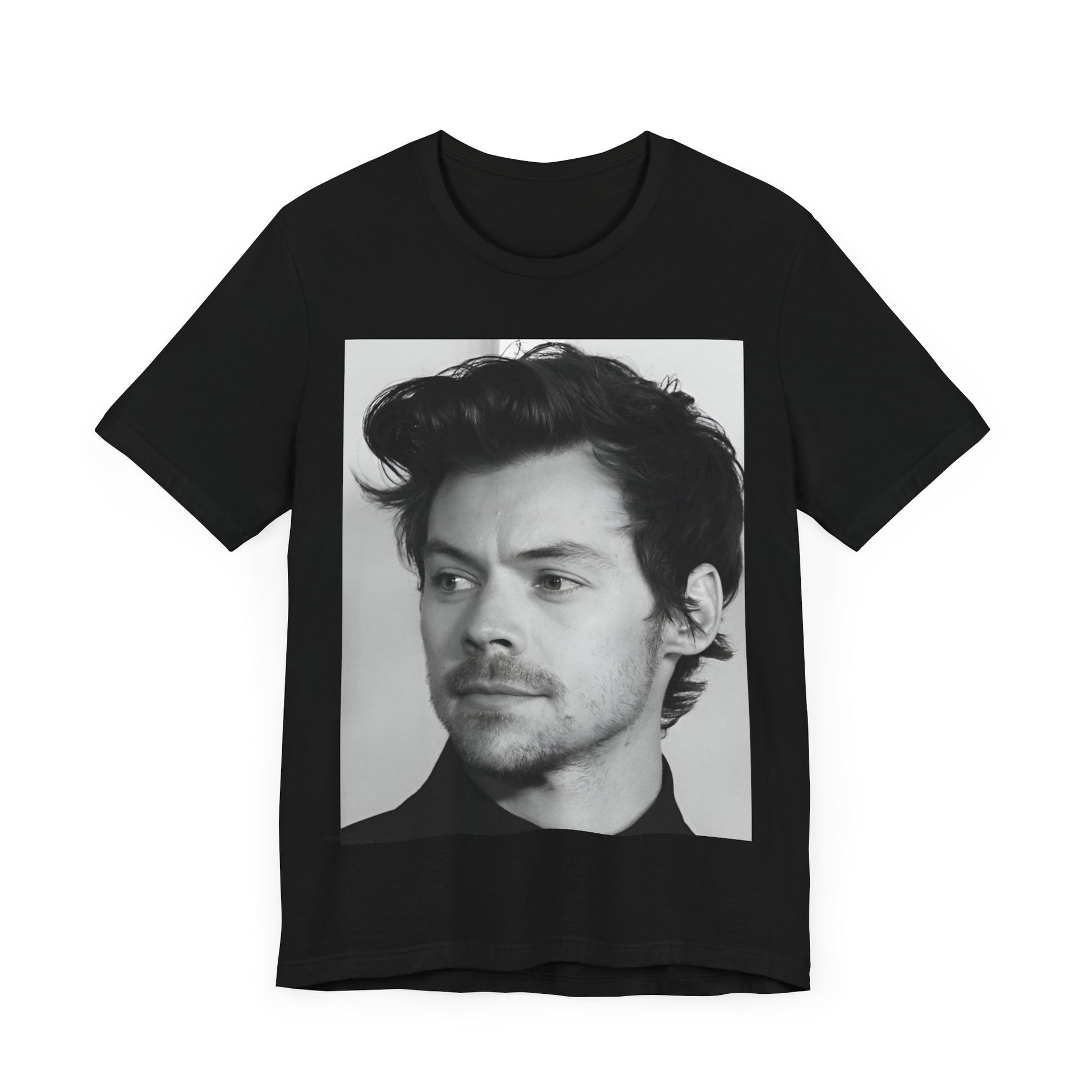 A black graphic t-shirt featuring a black and white, monochrome graphic or photo of Harry Styles.