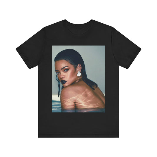 A black graphic t-shirt featuring a vintage pop icon graphic of Rihanna.