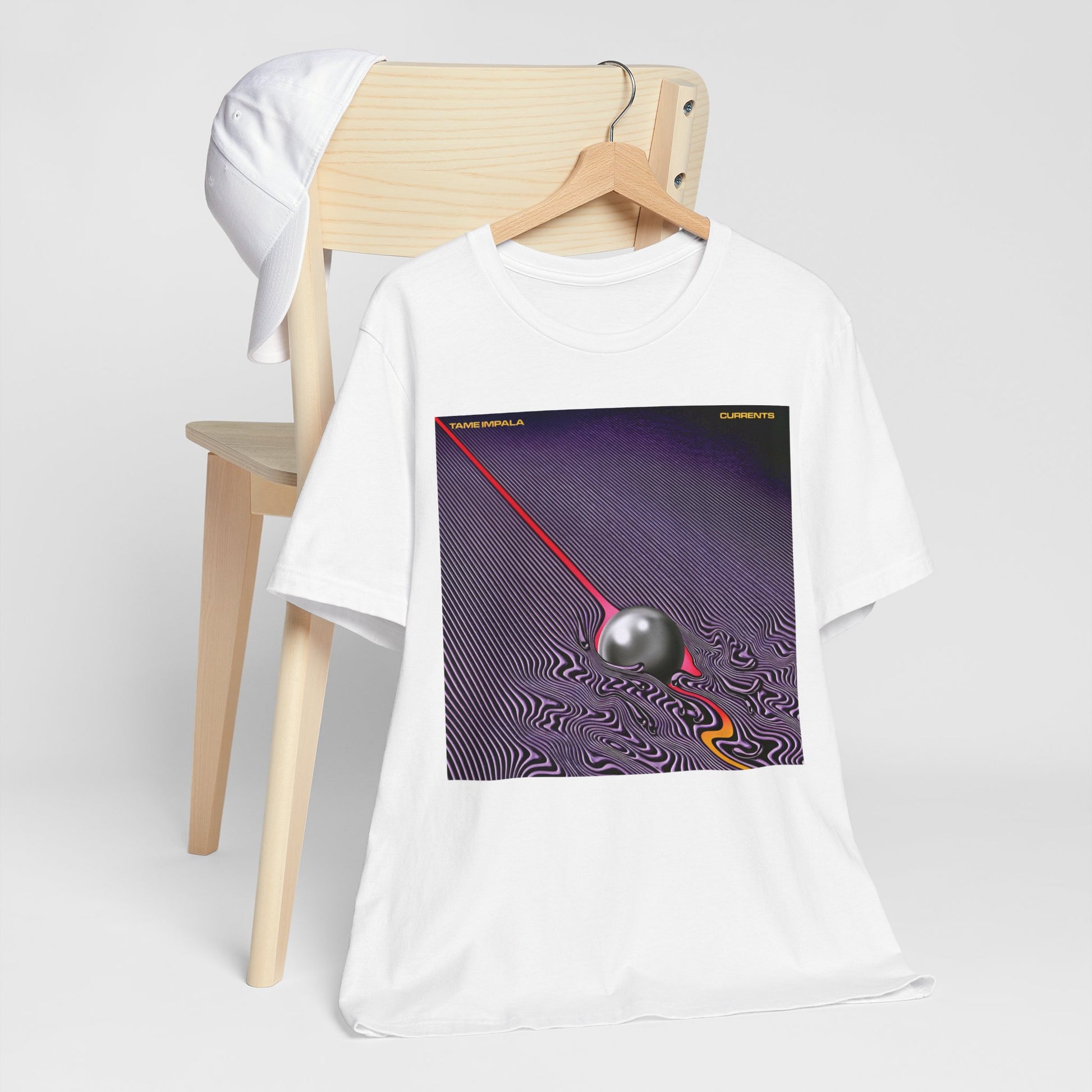 A black graphic t-shirt featuring a graphic related to Tame Impala's 'Currents' album.