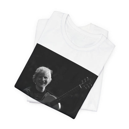 A black graphic t-shirt featuring a photo of Ed Sheeran performing live with his guitar.