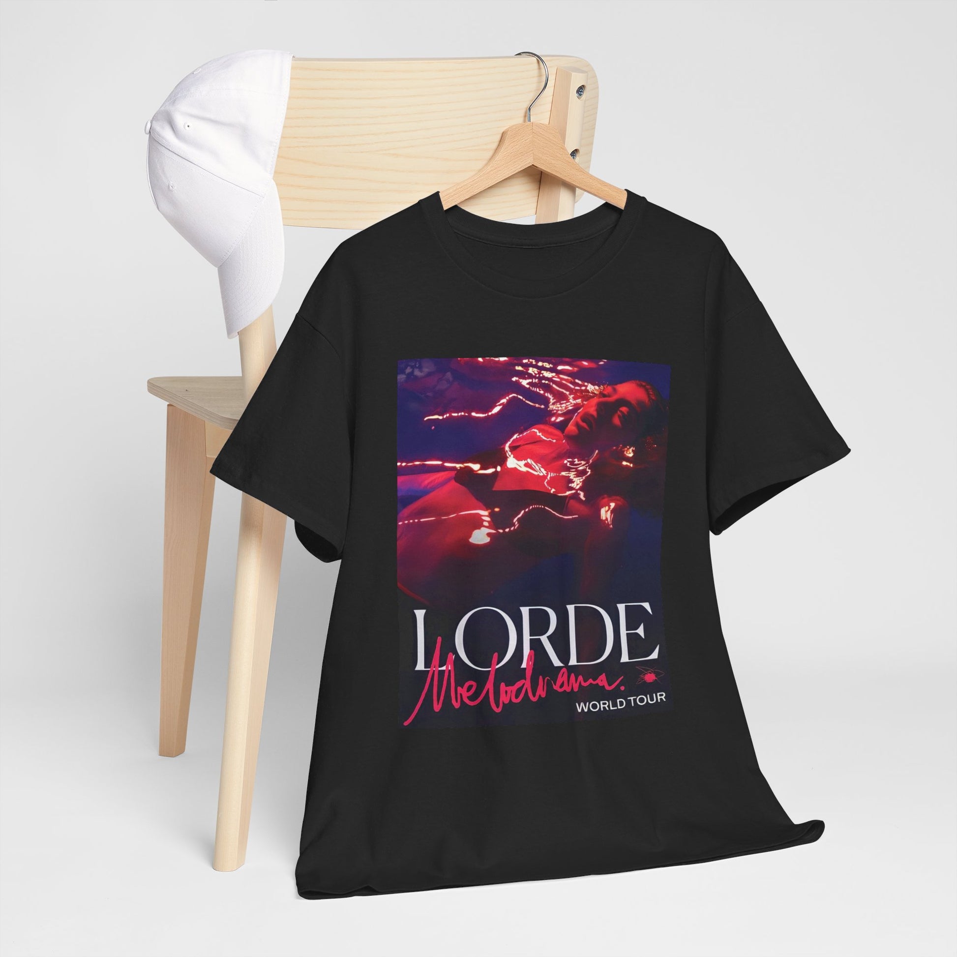 A black graphic t-shirt featuring a graphic related to Lorde's 'Melodrama' World Tour.