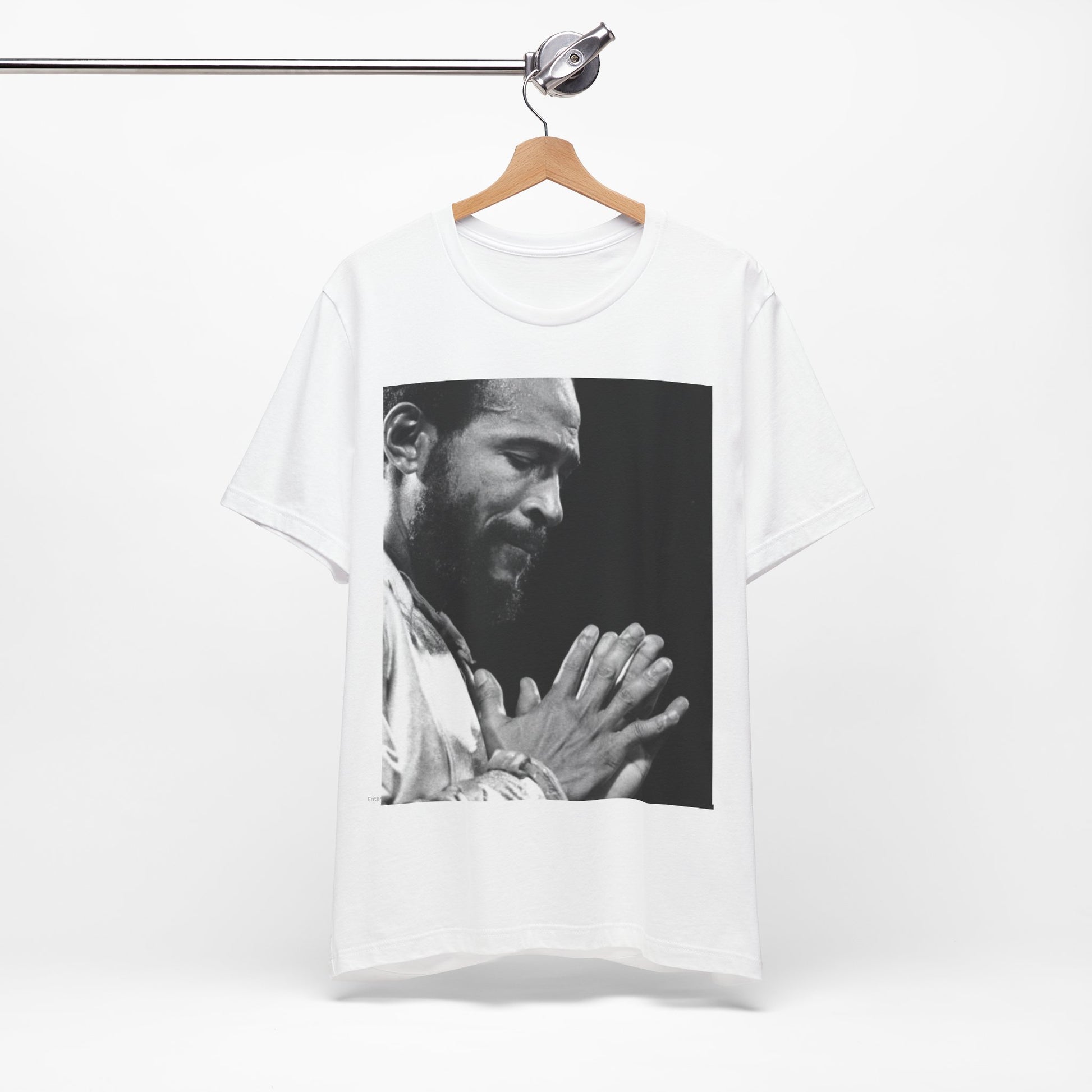 A black graphic t-shirt featuring a 70s graphic of Marvin Gaye emphasizing his soulful voice.