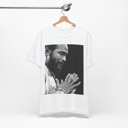 A black graphic t-shirt featuring a 70s graphic of Marvin Gaye emphasizing his soulful voice.