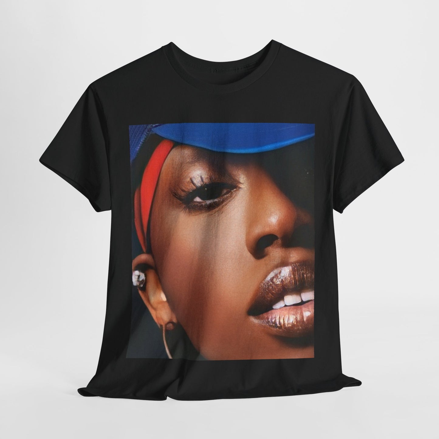 A black graphic t-shirt featuring a graphic of Missy Elliott as a creative genius in hip hop.