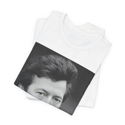 A black graphic t-shirt featuring a 70s rock aesthetic graphic of Eric Clapton.