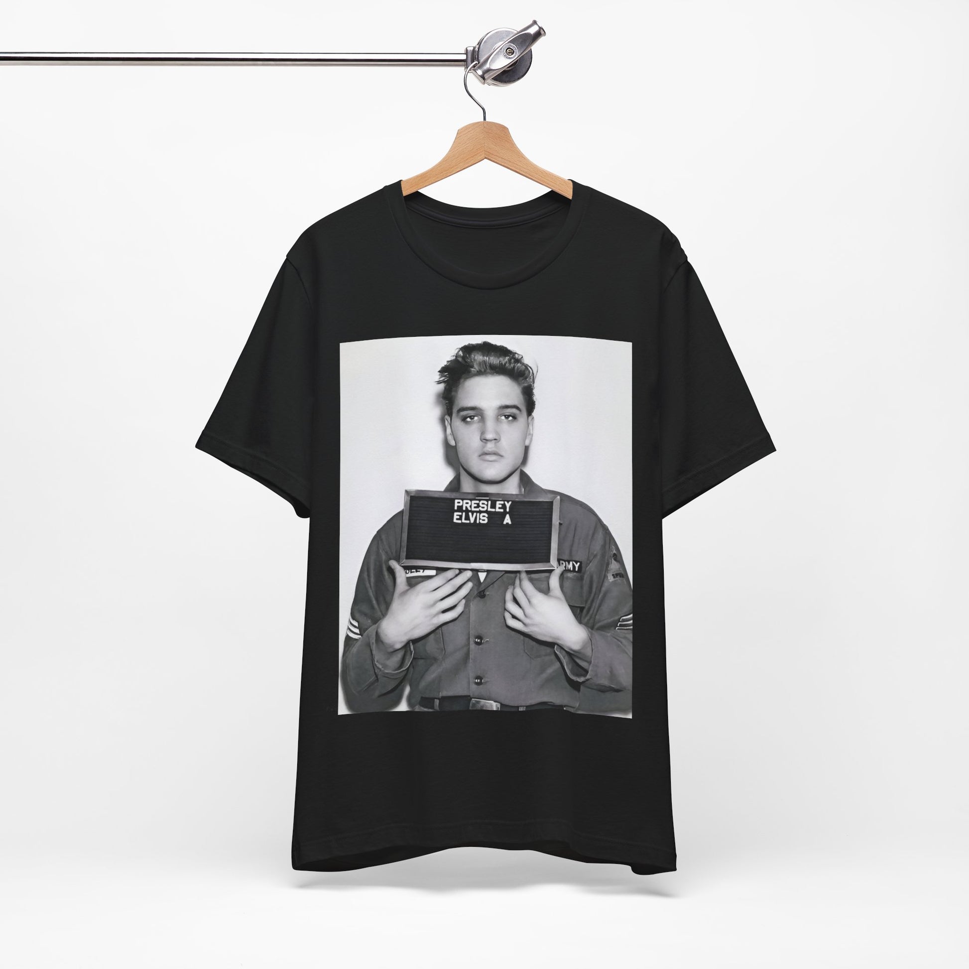 A black graphic t-shirt featuring a retro mugshot photo of Elvis Presley.