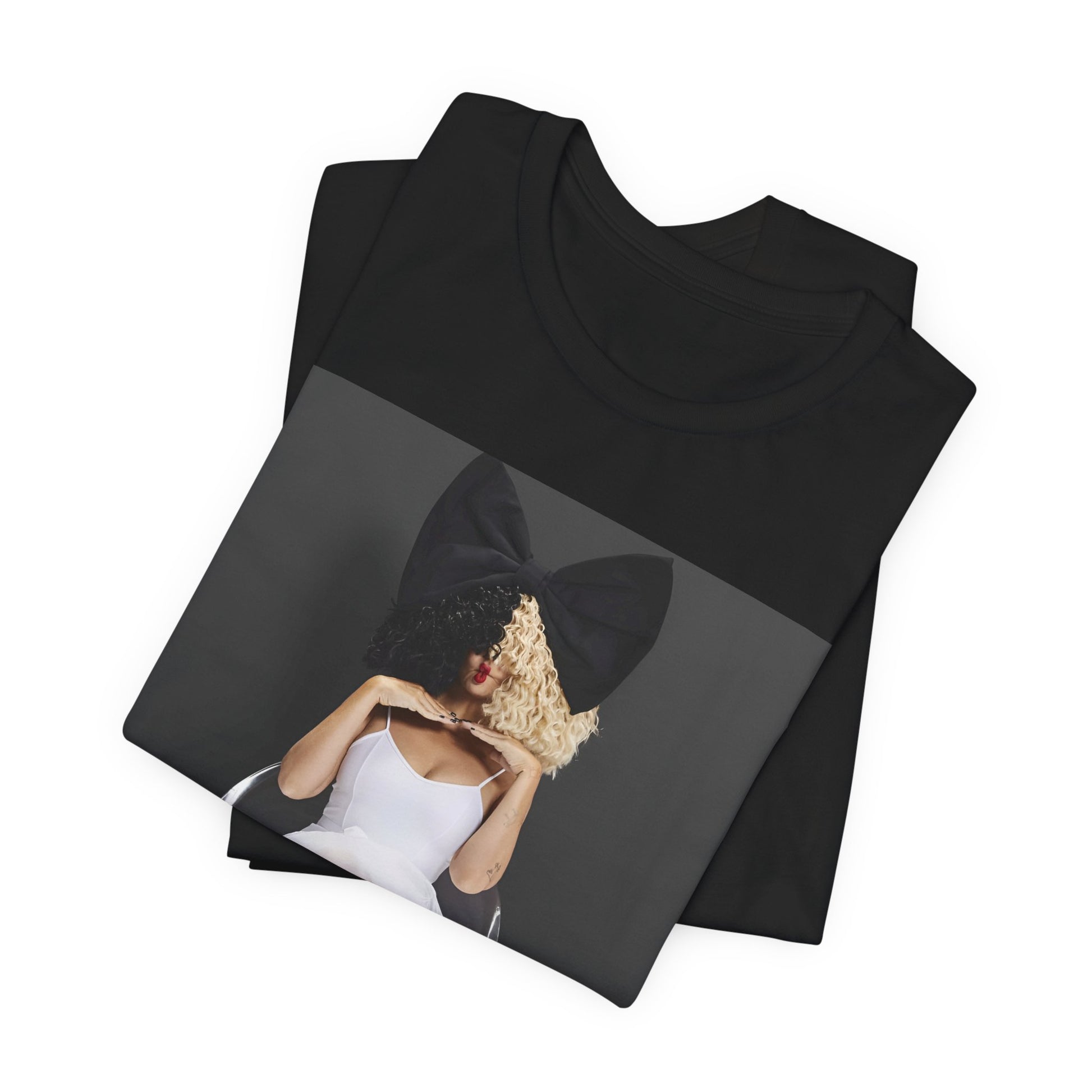 A black graphic t-shirt featuring a graphic of Sia's iconic wig style.