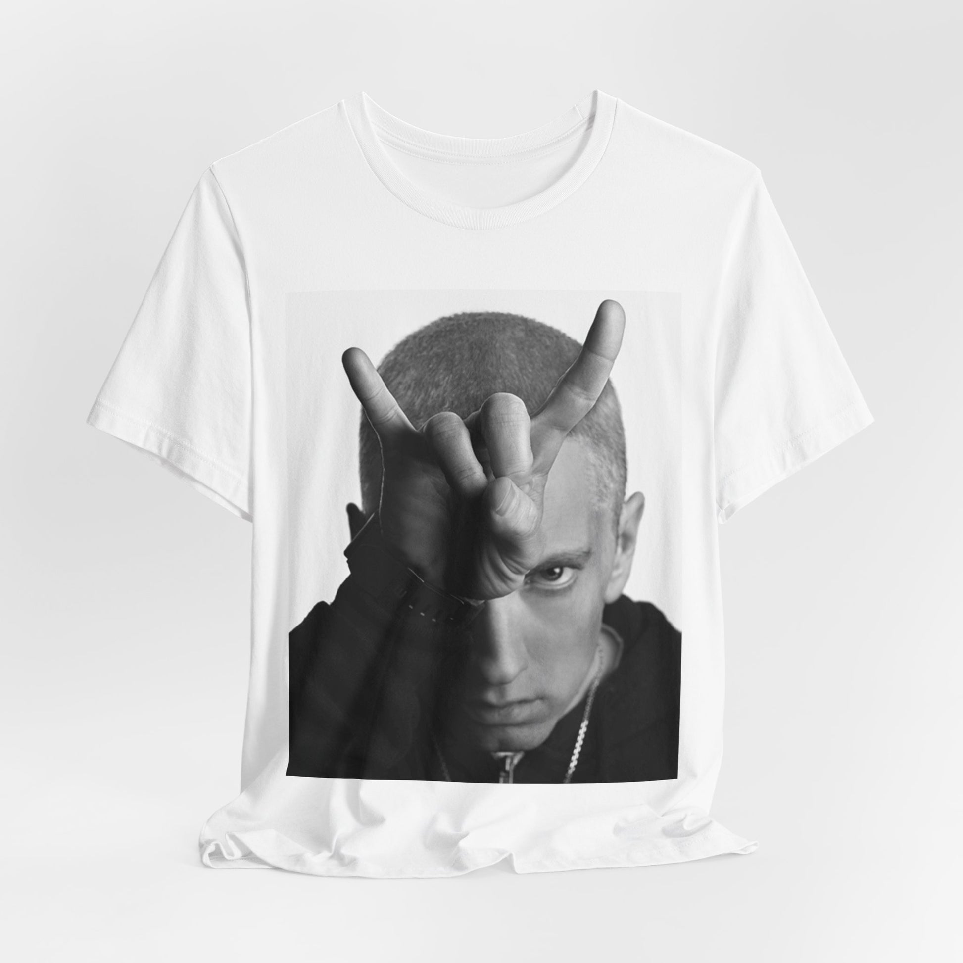 A black graphic t-shirt featuring a graphic related to Eminem's 'My Name Is' song or era.