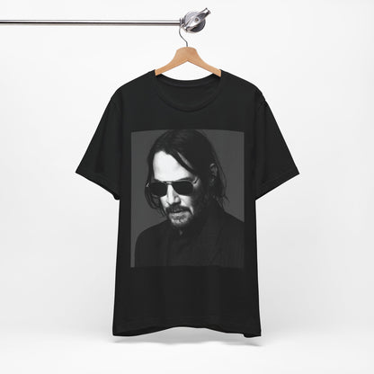 A black graphic t-shirt featuring a graphic of Keanu Reeves with a rebel spirit aesthetic.