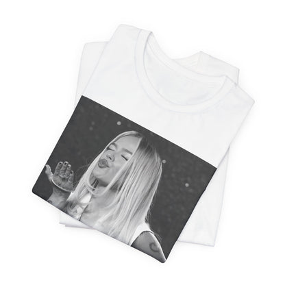 A black graphic t-shirt featuring a graphic of Karol G with a 'La Bichota Kiss' theme.